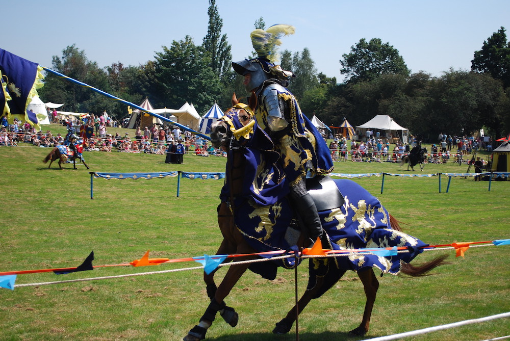 Figure 1: Re-enactment of a joust at Bodiam Castle. This knight has his coat of arms emblazoned on every banner